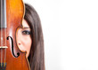 Young girl with violin against white background with copy space.