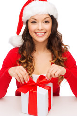 Sticker - smiling woman in santa helper hat with gift box