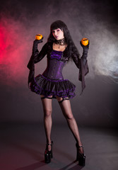 Poster - Beautiful witch in purple and black gothic Halloween costume