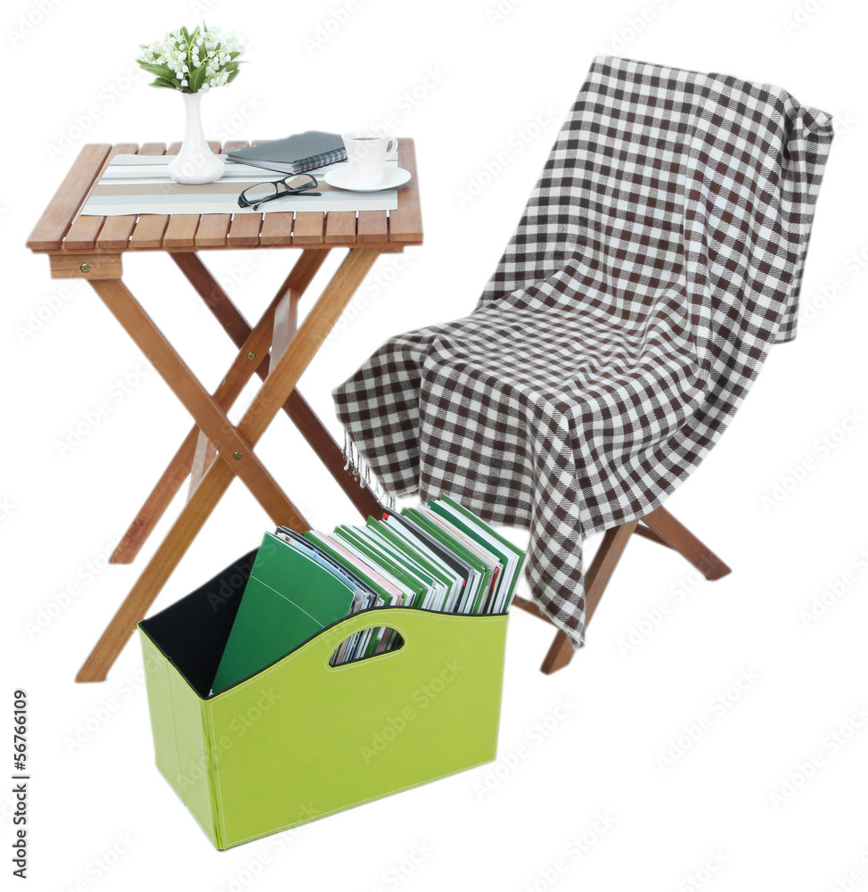 Magazines and folders in green box isolated on white