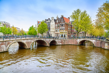 Wall Mural - Amsterdam. Bridge and water canal. Holland or Netherlands.