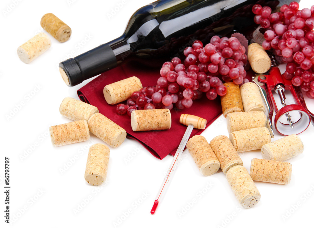 Bottle of wine, grapes and corks, isolated on white