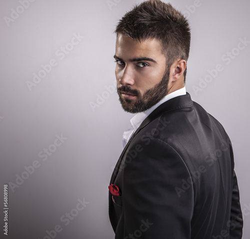 Naklejka na szybę Elegant young handsome man. Studio fashion portrait.