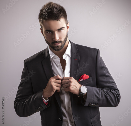 Fototapeta na wymiar Elegant young handsome man. Studio fashion portrait.