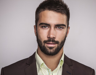 Wall Mural - Elegant young handsome man. Studio fashion portrait.