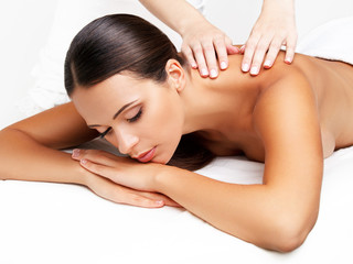 Wall Mural - Massage. Close-up of a Beautiful Woman Getting Spa Treatment