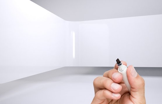 Hand holding a marker