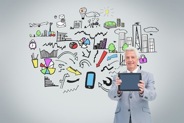 Poster - Mature businessman showing his tablet