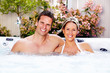 © grinny - Happy couple in hot tub