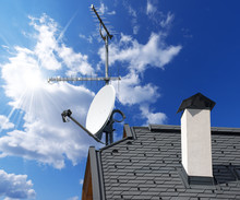 Satellite Dish And Antenna TV On Blue Sky