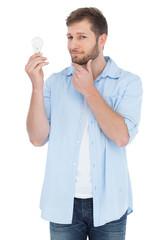 Poster - Handsome model holding a bulb