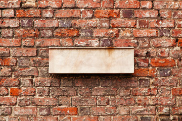 Wall Mural - Blank space for sign on a brick wall