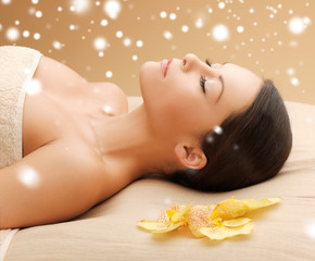 Poster - woman in spa salon lying on the massage desk