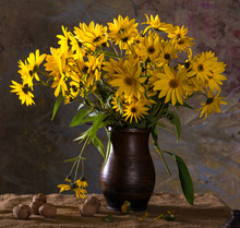 Bunch Of Bright Yellow Flowers (rudbeckia) In Brown Vase And Wal