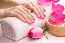 pink manicure with towel. Spa