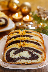 Canvas Print - Poppy seed cake in golden christmas setting. Selective focus