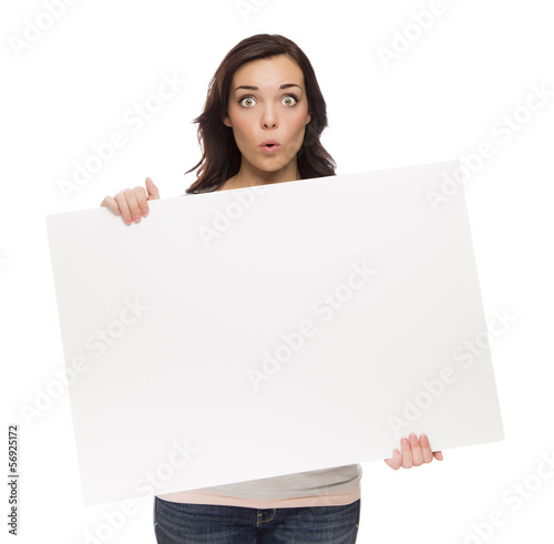 Fotografering Wide Eyed Mixed Race Female Holding Blank Sign on White.