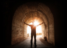 Man Stands Inside Of Old Dark Tunnel