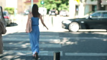 Woman Crossing The Street In The City, Steadicam Shot