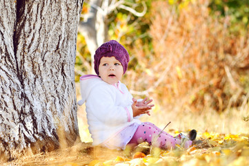 Wall Mural - baby girl  under the tree