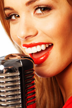 Beautiful Woman Singing Into A Microphone