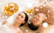 © Syda Productions - couple in spa salon lying on the massage desks