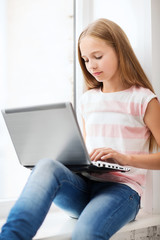 Wall Mural - girl with laptop pc at school