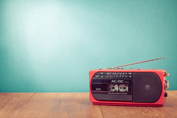 Poster - Retro red radio cassette player in front mint green background