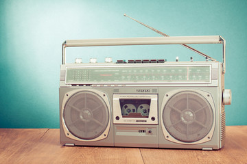 Wall Mural - retro ghetto blaster on table in front mint green background