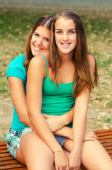 Wall Mural - Two teenage girls having fun