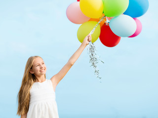 happy girl with colorful balloons