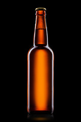 Beer bottle isolated on black