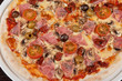 © olinchuk - pizza with ham and mushrooms