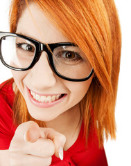 woman in glasses pointing finger