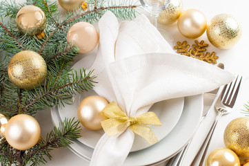 Christmas table setting in gold tones