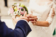 Holding hands with wedding rings