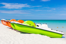 Colorful Pedalos Docked At A Tropical Beach
