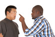 © sixdays - African American Asian brothers having an arguement
