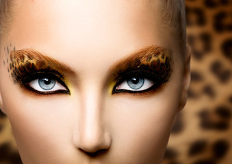 Beauty Fashion Model Girl with Holiday Leopard Makeup