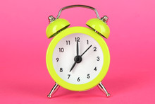 Green Alarm Clock On Pink Background