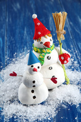 Wall Mural - Beautiful snowmen and Christmas decor, on bright background