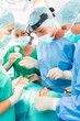 © Kzenon - Surgeons operating patient in operation theater