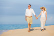 © EpicStockMedia - Middle Aged Couple Enjoying Walk on the Beach