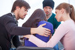 © BlueSkyImages - Group of people comforting upset woman.