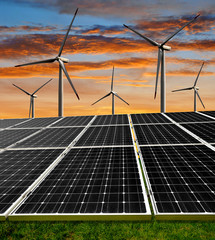Wall Mural - solar energy panels and wind turbines in the sunset