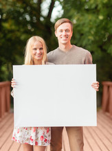 Romantic Couple With Blank White Board