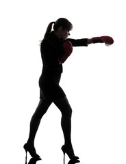 Canvas Print - business woman punching boxing gloves silhouette