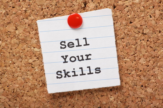 Sell Your Skills paper note on a cork notice board