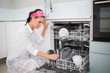 © lightwavemedia - Smiling charming woman using dish washer