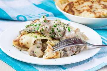 Wall Mural - Russian pancakes with chicken and mushrooms champignon